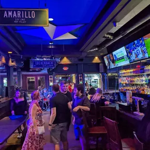 a crowd of people at a bar