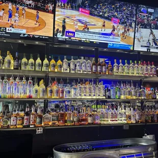 a bar filled with liquor bottles