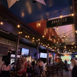 a crowd of people at a bar