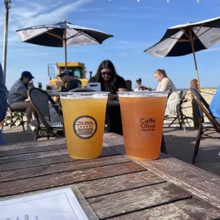 two beer glasses on a table