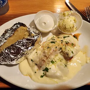 Stuffed salmon with overcooked baked potato.