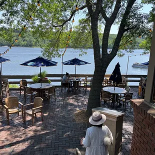 a woman walking down the dock