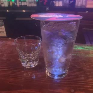 a glass of water and a shot of ice