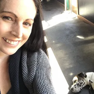 a woman and her dog in a garage