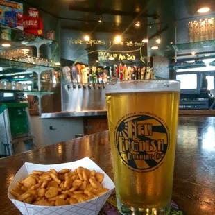 a pint of beer and a basket of fries
