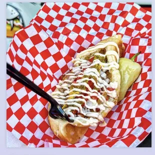 a hot dog with ketchup and mustard