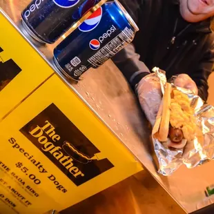 a man holding a hot dog