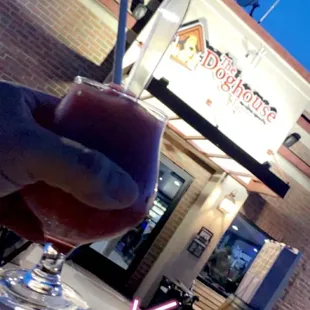 a hand holding a wine glass