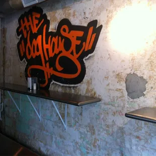 a bar with a sign on the wall