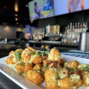 a platter of fried tater tots