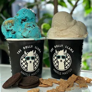 two cups of ice cream and cookies