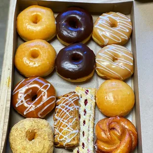 Cream cheese, cinnamon roll, 3 glazed, 2 chocolate glazed, 2 maple, 1 caramel and 2 danishes