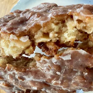 a half eaten donut on a plate