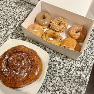 Cinnamon roll and 6 donuts about $13