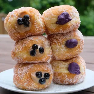 a stack of blueberry donuts