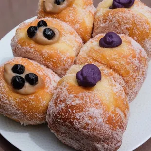 four donuts on a plate