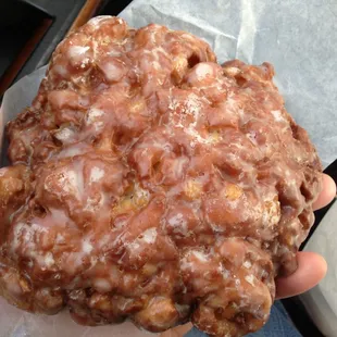Pineapple fritters the size of a man hand.