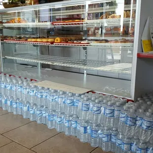 Front of the store and alkaline bottled water they sell