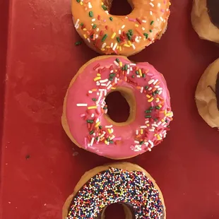 a variety of donuts with sprinkles