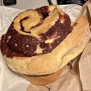 Hot and fresh plain cinnamon roll. (It also comes with icing)