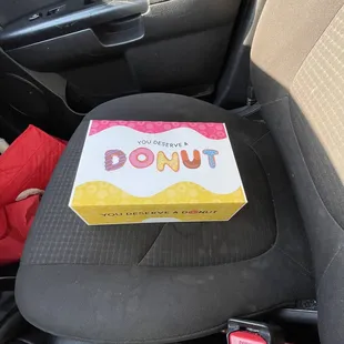 Look how cute the box is! (Ew ignore my seat, I spilled my drink lol)