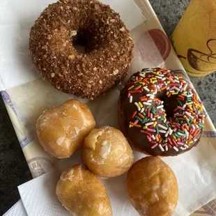 Old fashioned cinnamon sugar and old fashioned chocolate sprinkles with glazed donut holes