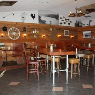 a restaurant with wooden walls