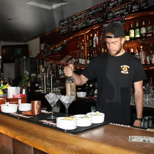 a bartender making a drink