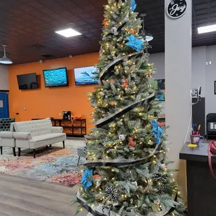 a decorated christmas tree in a store