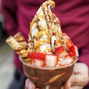 a person holding a dessert