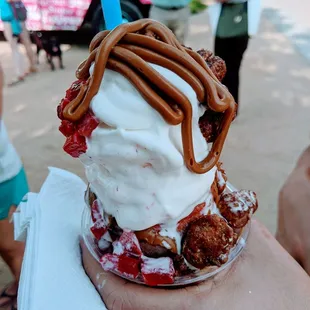 a person holding a dessert
