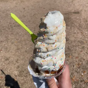 Vanilla Ice-cream in a signature doughcone with churro dust and sprinkles. Already a few licks in and it's so good!