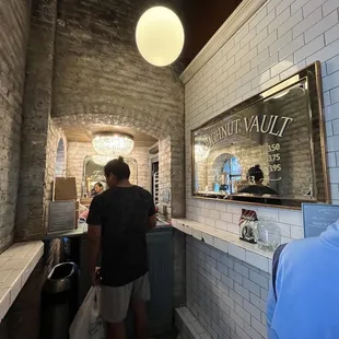 a man standing in front of a counter