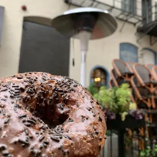 a chocolate donut with sprinkles