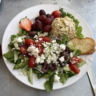 Salad trio with Chicken salad, Greek salad, and fruit.