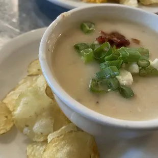 Baked potato soup with goat cheese, bacon and scallions.
