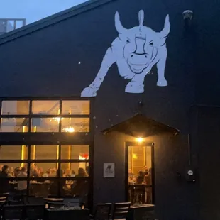 a dog on the side of a building