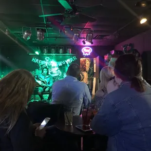 people sitting at a bar