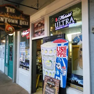 a storefront with a sign for the downtown deli