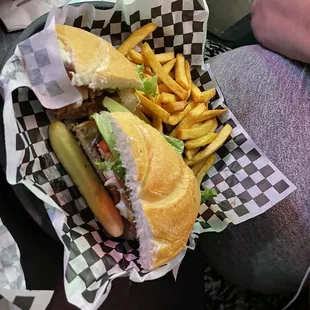 This the Black and Bleu Burger with fries.