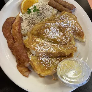 French toast, fried eggs, sausage and bacon.