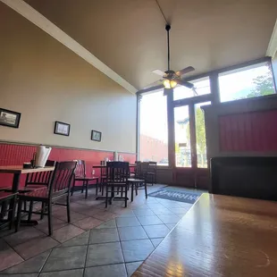 a dining room with a ceiling fan