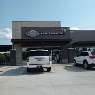 the outside of a sports bar and grill