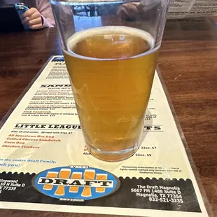 a glass of beer on a table