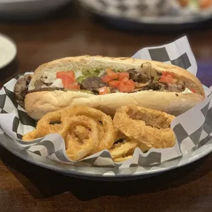 Tender Angus Philly cheesesteak with amazing onion rings that had just a little spicy bite to them.