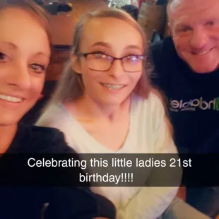 a photo of a man and two women