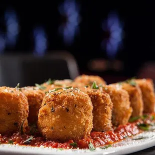 a plate of deep fried chicken nuggies