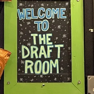 a welcome sign for the draft room