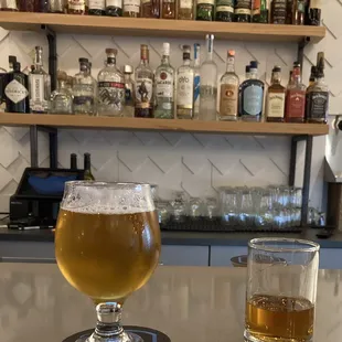 a glass of beer and a half full glass