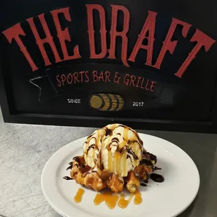 a plate of ice cream and caramel